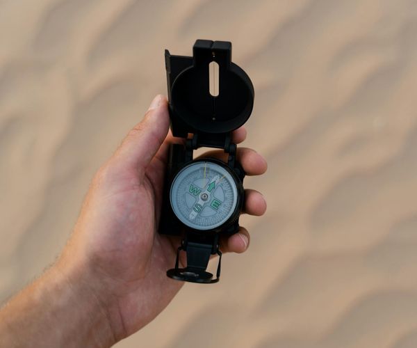 A compass pointing towards inner peace, symbolizing the journey of discovery.