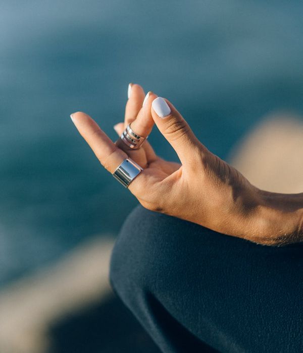 Woman in a calm yoga pose, embodying harmony and peace.